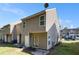 Townhome backyard featuring a cement patio and small patch of grass at 2236 Bigwood Trl, Atlanta, GA 30349