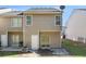 View of back of townhome featuring a small yard and patio at 2236 Bigwood Trl, Atlanta, GA 30349