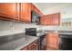 Well-equipped kitchen featuring wood cabinets, modern appliances, and plenty of counter space at 2236 Bigwood Trl, Atlanta, GA 30349