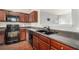 Well-equipped kitchen featuring wood cabinets, modern appliances, and ample counter space for cooking at 2236 Bigwood Trl, Atlanta, GA 30349
