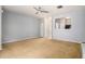Spacious living room featuring neutral paint, ceiling fan, and open access to the kitchen at 2236 Bigwood Trl, Atlanta, GA 30349