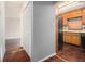 A kitchen, with views of a closet, with wood-look flooring and wood cabinets at 570 Knollwood Dr, Stockbridge, GA 30281