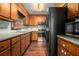 Traditional kitchen with granite countertops, stainless steel appliances, and wood cabinets at 570 Knollwood Dr, Stockbridge, GA 30281