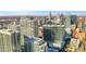 Beautiful view of modern Atlanta buildings with rooftop pool and amenities, showcasing a vibrant urban landscape at 855 Peachtree Ne St # 1703, Atlanta, GA 30308