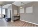 Modern entryway features wood floors, a pendant light, decorative wall art, and a hall table at 855 Peachtree Ne St # 1703, Atlanta, GA 30308