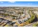 An aerial view of closely-knit residential neighborhood with tree-lined streets under a bright sky at 165 Birch St, Hiram, GA 30141