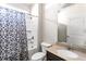 Cozy bathroom with granite countertop, framed mirror, and tub with shower at 165 Birch St, Hiram, GA 30141