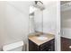 Compact bathroom with a granite counter, mirror, and neutral walls at 165 Birch St, Hiram, GA 30141