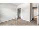 Neutral bedroom features an open closet and neutral walls and carpeting at 165 Birch St, Hiram, GA 30141