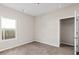 Cozy bedroom featuring carpet, closet and window with natural light at 165 Birch St, Hiram, GA 30141