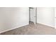 Clean bedroom with closet and neutral colored carpeting and walls at 165 Birch St, Hiram, GA 30141