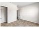 Simple bedroom with neutral carpet, closet, and light-colored walls at 165 Birch St, Hiram, GA 30141