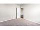 Carpeted bedroom featuring door to closet and neutral walls at 165 Birch St, Hiram, GA 30141