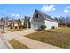 View of a single Gathering home with attached garage and well-kept lawn at 165 Birch St, Hiram, GA 30141