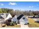 Charming one-story home featuring light gray siding, black shutters, a well-kept lawn, and a convenient attached garage at 165 Birch St, Hiram, GA 30141