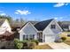 Charming one-story home featuring light gray siding, black shutters, a well-kept lawn, and a convenient attached garage at 165 Birch St, Hiram, GA 30141