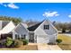 Charming one-story home featuring light gray siding, black shutters, a well-kept lawn, and a convenient attached garage at 165 Birch St, Hiram, GA 30141