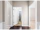 Hallway shows entries to bathroom and bedroom with neutral decor at 165 Birch St, Hiram, GA 30141