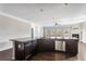 Kitchen island with stainless steel dishwasher and sink area in front of a bright living space at 165 Birch St, Hiram, GA 30141