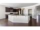 Spacious kitchen features dark wood cabinets, stainless steel appliances, and granite countertops at 165 Birch St, Hiram, GA 30141