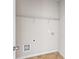 Laundry room with overhead shelf and hookups at 165 Birch St, Hiram, GA 30141