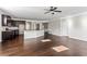 Open-concept living space includes kitchen, dining area, and expansive wood floors at 165 Birch St, Hiram, GA 30141