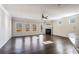 Inviting living room has a fireplace, ceiling fan, and a view through back windows at 165 Birch St, Hiram, GA 30141