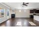 Inviting living room with hardwood floors, fireplace, and modern ceiling fan at 165 Birch St, Hiram, GA 30141