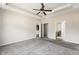 Spacious main bedroom with tray ceiling, ceiling fan, ensuite bathroom and walk-in closet at 165 Birch St, Hiram, GA 30141