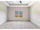 Spacious main bedroom featuring a large window letting in lots of natural light at 165 Birch St, Hiram, GA 30141