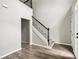 Welcoming foyer with staircase, hardwood floors, and natural light at 2451 Napa Valley Dr, Villa Rica, GA 30180