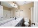 Bathroom with a large white vanity, a tub-shower combination and a large mirror with modern light fixtures at 2898 Lakemont Sw Dr, Marietta, GA 30060