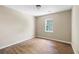 Bedroom with laminate flooring, neutral paint, and a large window offering plenty of natural light at 2898 Lakemont Sw Dr, Marietta, GA 30060