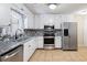 Charming kitchen with stainless steel appliances, ample cabinetry, and stylish countertop accents at 2898 Lakemont Sw Dr, Marietta, GA 30060