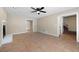Spacious living room featuring a fireplace, tile floors, ceiling fan, and an open layout with staircase access at 2898 Lakemont Sw Dr, Marietta, GA 30060