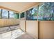 Covered patio offers a view of the fenced yard and surrounding trees at 2898 Lakemont Sw Dr, Marietta, GA 30060