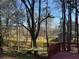 Backyard view from deck features a hammock and beautiful scenery at 3442 Fox Hollow Dr, Marietta, GA 30068