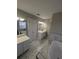 Elegant bathroom with double vanities, marble flooring and a soaking tub at 3442 Fox Hollow Dr, Marietta, GA 30068