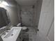 Stylish bathroom featuring a marble shower and vanity with designer fixtures at 3442 Fox Hollow Dr, Marietta, GA 30068