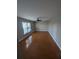 Spacious bedroom offers great natural light, wood flooring, and a ceiling fan at 3442 Fox Hollow Dr, Marietta, GA 30068