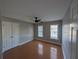 Bedroom with a ceiling fan, closet, and two windows offering great natural light at 3442 Fox Hollow Dr, Marietta, GA 30068