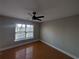 A cozy bedroom offers great natural light, wood flooring, and a ceiling fan at 3442 Fox Hollow Dr, Marietta, GA 30068