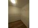 Walk-in closet with built-in shelving and hardwood floors at 3442 Fox Hollow Dr, Marietta, GA 30068
