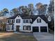 Stunning two-story home with a beautifully painted brick exterior and black trim accents at 3442 Fox Hollow Dr, Marietta, GA 30068