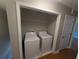 Laundry room with washer and dryer hookups and built in shelving at 3442 Fox Hollow Dr, Marietta, GA 30068