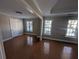 Bright and airy living room with hardwood floors and ample windows at 3442 Fox Hollow Dr, Marietta, GA 30068