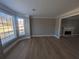 Bright and airy living room with fireplace and views of the front and backyard at 3442 Fox Hollow Dr, Marietta, GA 30068