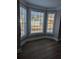 Sunlit bay window floods this living area with abundant natural light and wood flooring at 3442 Fox Hollow Dr, Marietta, GA 30068