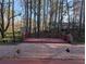 Backyard patio and deck are bordered by the treeline of this peaceful property at 3442 Fox Hollow Dr, Marietta, GA 30068