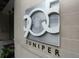 Exterior shot of the building with prominent signage for '905 Juniper' at 905 Juniper Ne St # 110, Atlanta, GA 30309